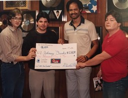 Allen Taylor, Leo David and "Big Daddy" Les King Cole presenting $1,001 to winner Johnny Franks